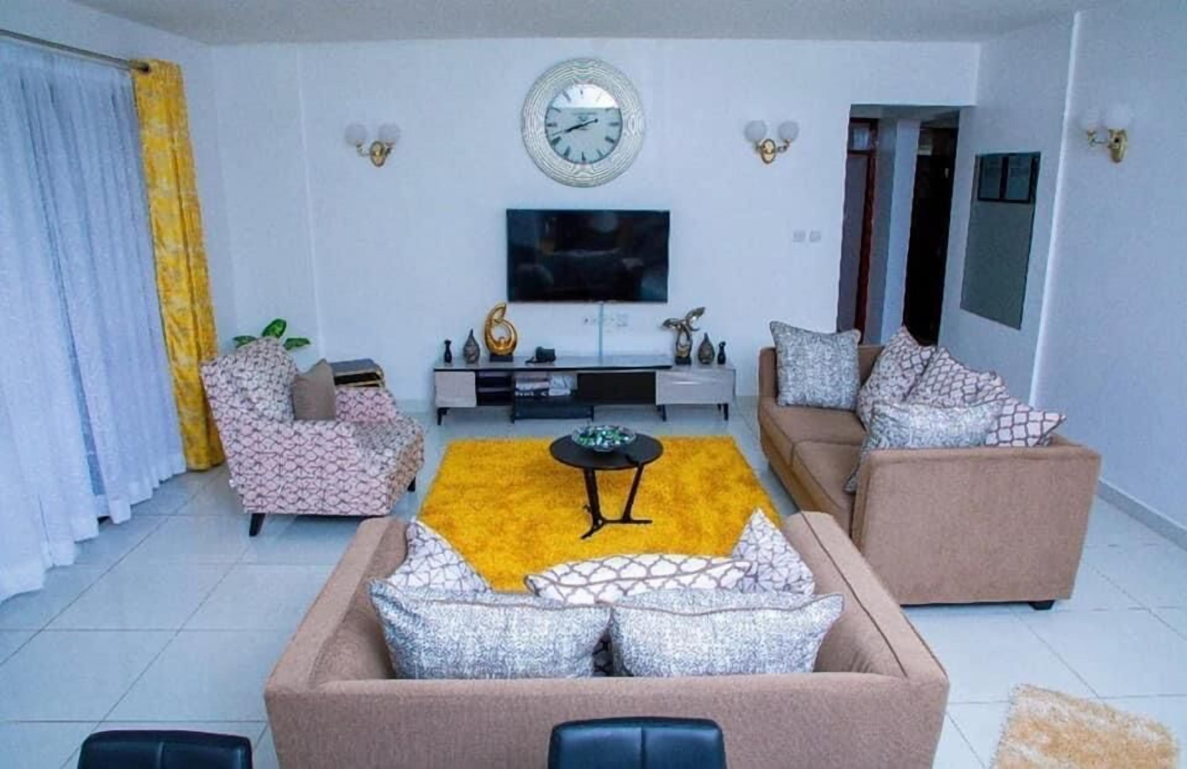 Deluxe Apartment | Living area | 32-inch Smart TV with digital channels