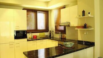 Fridge, microwave, cookware/dishes/utensils