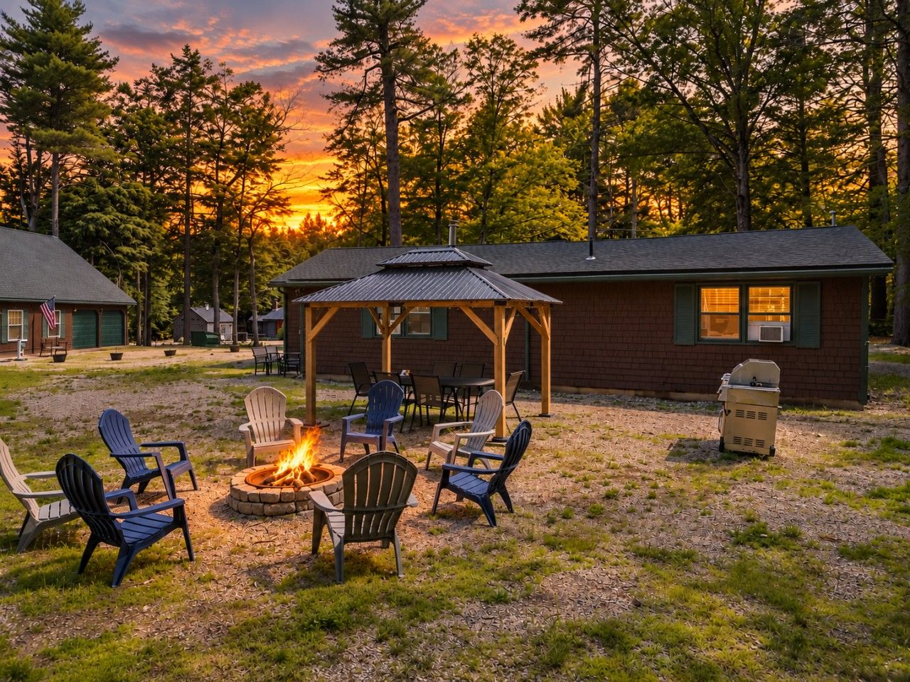 A patio area with outdoor seating and a fire pit.