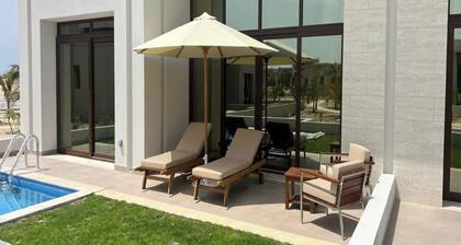 One-Bedroom Oasis with Pool View