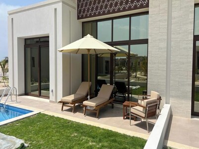 One-Bedroom Oasis with Pool View