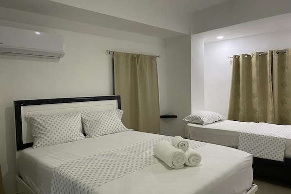 Family Apartment, City View | Blackout drapes, iron/ironing board, free WiFi