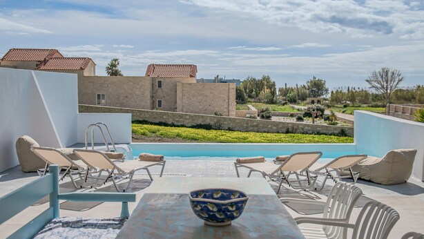 A rooftop pool area with lounge chairs and a table, a clear view of the surrounding landscape, and a bowl on the table. - Mythos villa 8,pool,Walking distance to beach (Damnoni)