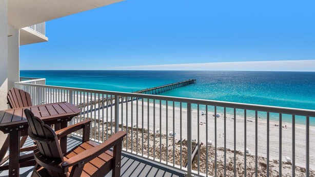 A balcony with a view of the ocean and a pier. - Summerwind Center 1204 (Navarre)