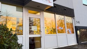 A hotel named 'Colourful Hotel' with a modern facade, large windows, and a visible address number '548'. - Colourful Hotel (Bielefeld)