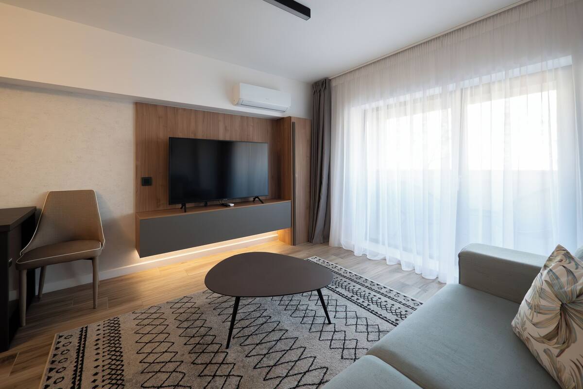 Deluxe-Apartment, Balkon | Wohnbereich