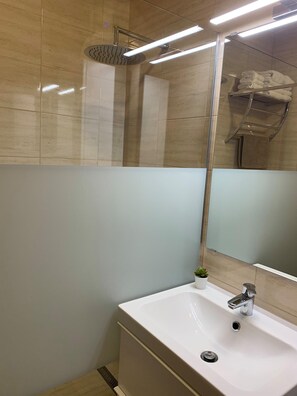 Shower, hair dryer, towels, soap