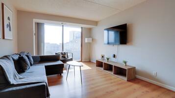 Apartment, Balcony, City View | Living area | Flat-screen TV