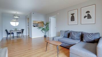 Apartment, Balcony, City View | Living area | Flat-screen TV