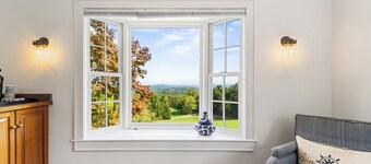 This spacious cottage is located in a private building with its own entrance a few steps from the Main Inn. Features include a private balcony, bedroom with a king-size bed, gas fireplaces, private bathroom with double whirlpool tub and separate show