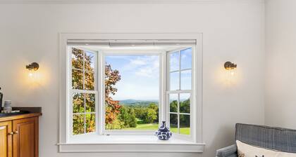 This spacious cottage is located in a private building with its own entrance a few steps from the Main Inn. Features include a private balcony, bedroom with a king-size bed, gas fireplaces, private bathroom with double whirlpool tub and separate show