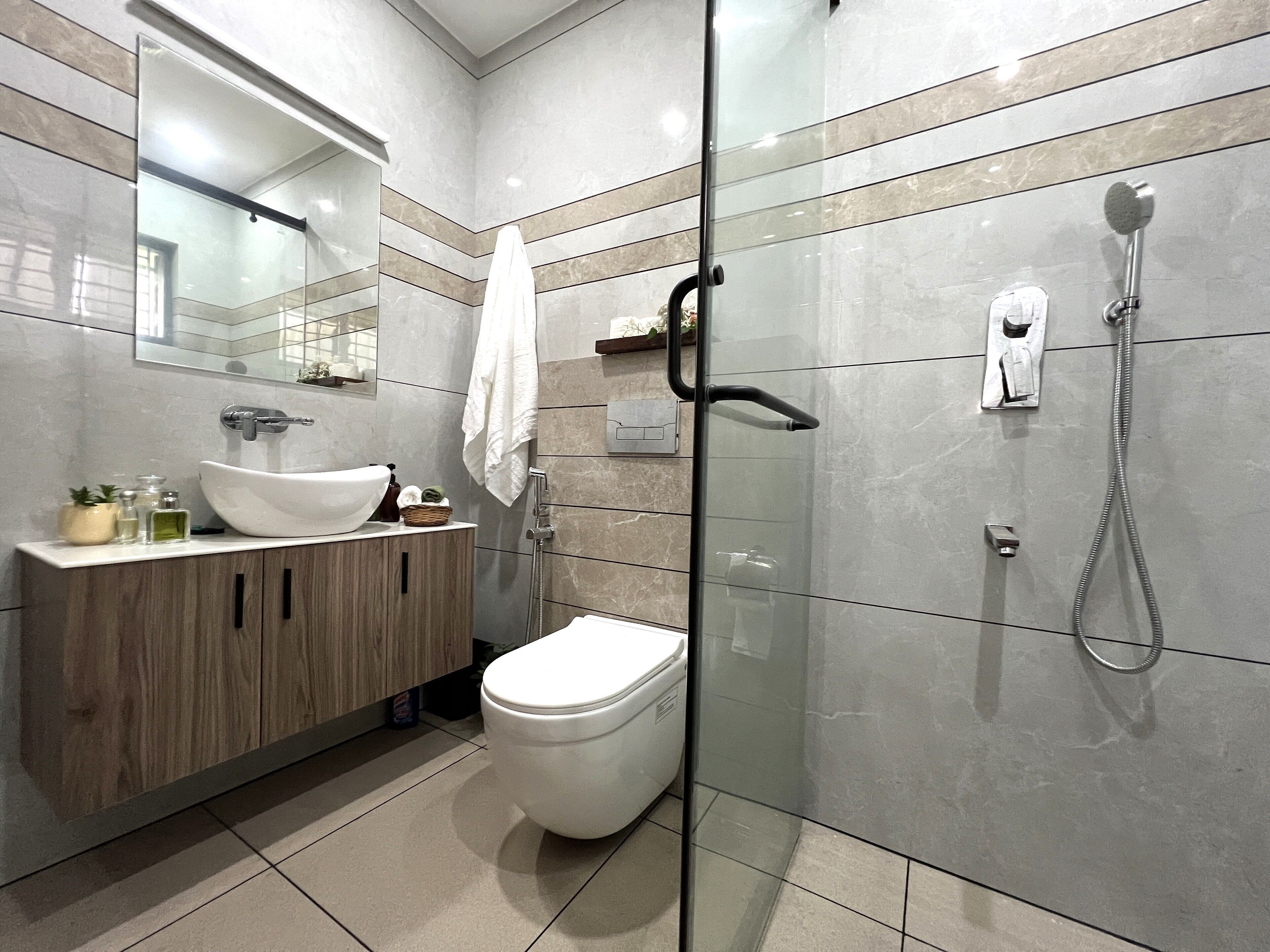Shower, towels, soap, toilet paper