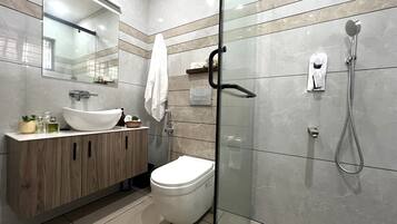 Shower, towels, soap, toilet paper