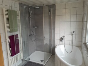 Shower, hair dryer, towels, toilet paper