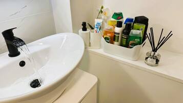 Hair dryer, towels, soap, shampoo