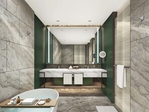Enjoy a relaxing soak in the bathtub and get ready in the spacious vanity area.