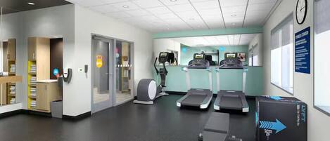 A fitness center with treadmills, an elliptical, and a stationary bike. There are lockers and a reception area visible.