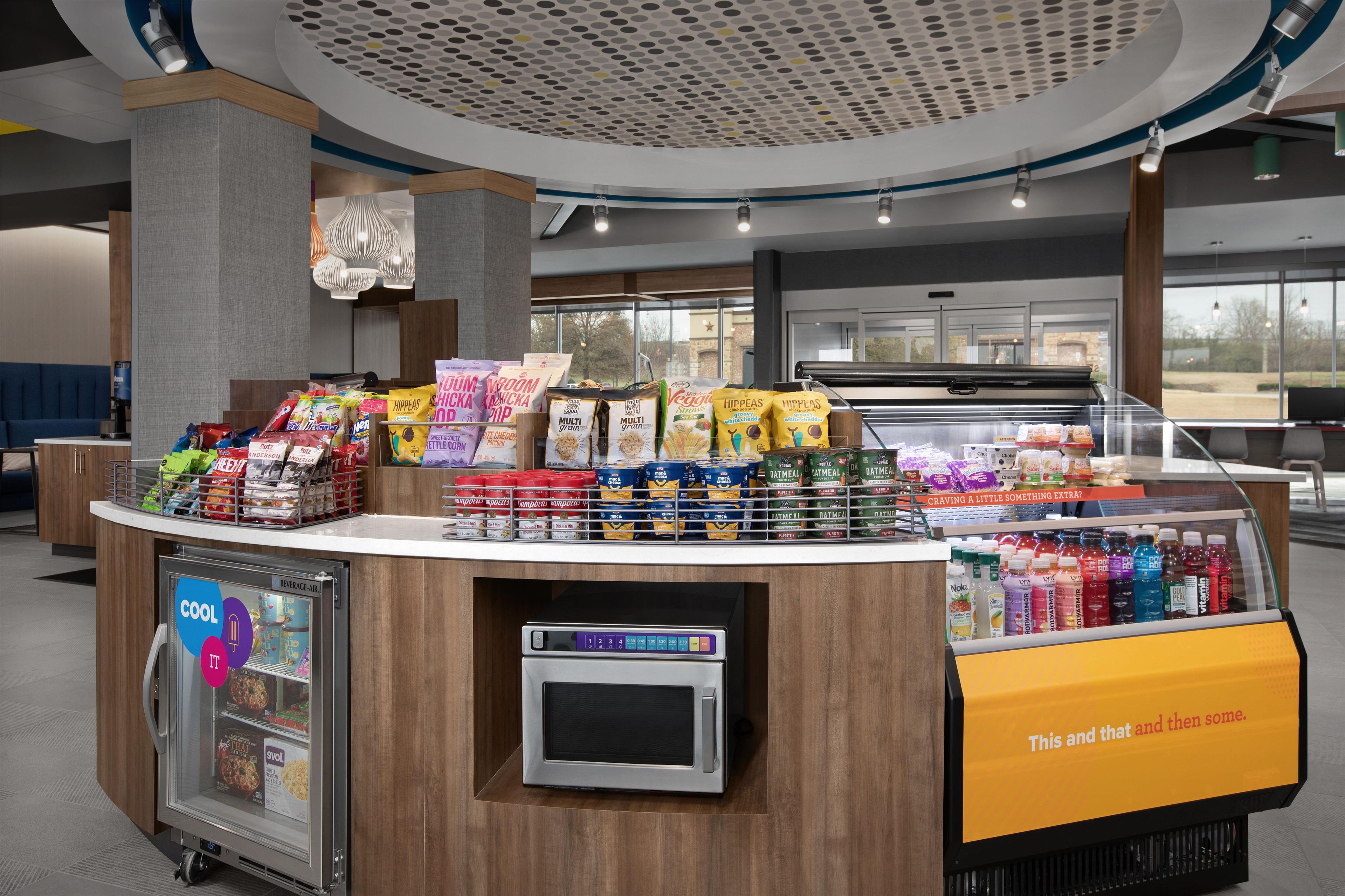 A self-service food kiosk with a variety of snacks, beverages, and prepared foods.