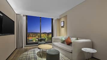 Suite Deluxe, 1 cama King size | Área de sala de estar