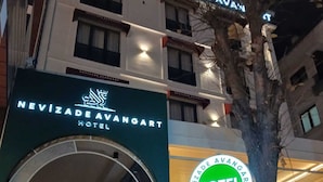 The exterior of the Nevizada Avangart Hotel with illuminated signage and a modern architectural design. - Nevizade Avangart Hotel (Istanbul)