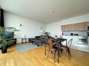 Luxury Apartment, City View | Living area | 40-inch LED TV with digital channels