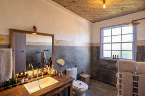 Superior House, Courtyard View | Bathroom | Hair dryer, slippers, towels, soap