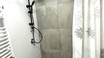 Shower, free toiletries, hair dryer, slippers