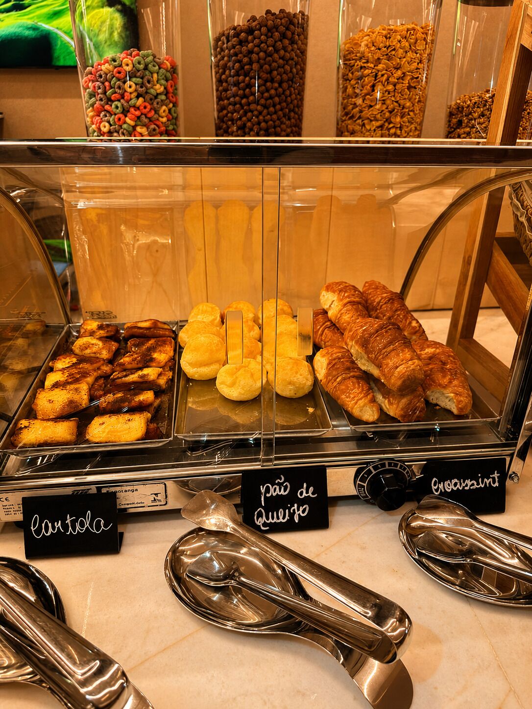 A bakery display case with various baked goods, including bread and pastries.