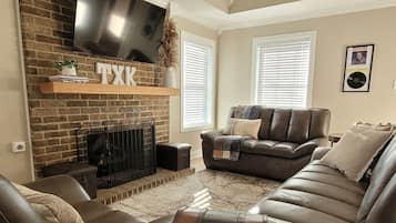 Smart TV, fireplace, books, offices