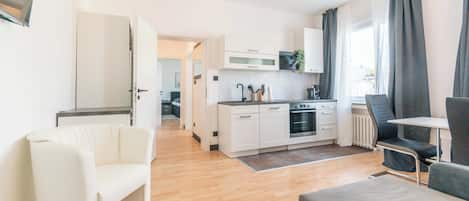 Business Apartment, 1 King Bed with Sofa bed, Kitchen | Living area | 43-inch Smart TV with digital channels, streaming services