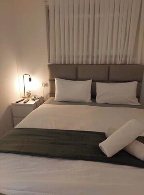 2 dormitorios, tabla de planchar con plancha, wifi y ropa de cama