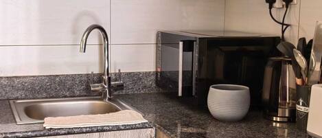 Fridge, microwave, stovetop, coffee/tea maker