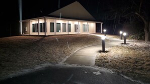 A modern house with a covered porch, large windows, and a sloped roof. - Spacious House Ideal for Sports Teams, Across from Spooky Nook in Manheim, PA (Manheim)