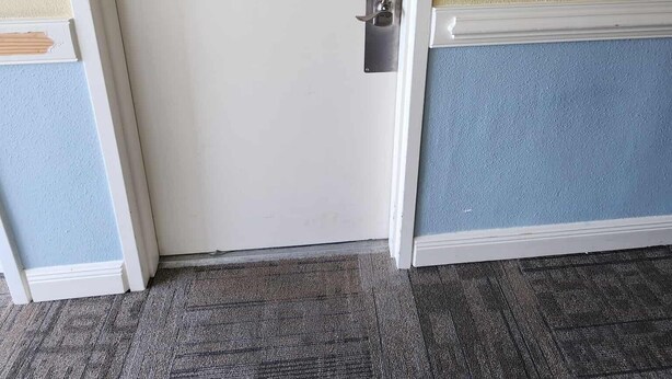 A closed door with a lock, a number plate '51102' on the wall, and a carpeted floor. - Ocean View Condo Sleeps 4! (Myrtle Beach)