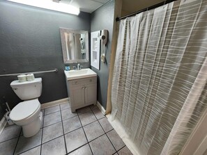 Shower, hair dryer, towels, shampoo