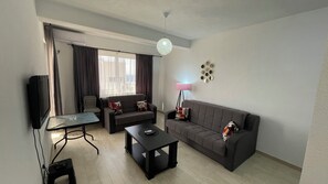 Appartement Deluxe, vue partielle sur la mer | 1 chambre, literie de qualité supérieure, minibar, chambres insonorisées