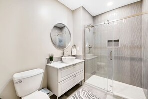 Shower, hair dryer, towels, soap