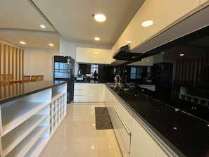 Deluxe Apartment, 2 Bedrooms, City View | Private kitchen | Fridge, microwave, stovetop, high chair - SUNRISE CITY VIEW Residences (Ho Chi Minh City)