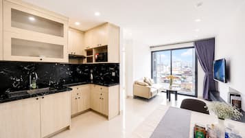 Family Apartment, Balcony, City View | Shared kitchen facilities | Full-size fridge, microwave, oven, stovetop