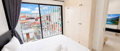 Family Apartment, Balcony, City View | In-room safe, desk, blackout curtains, free WiFi