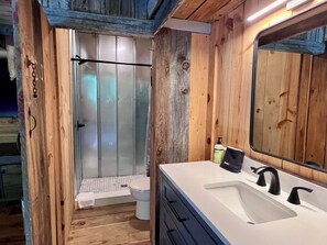 Shower, towels, soap, toilet paper