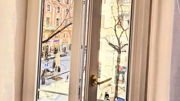 A window with a view of a street and buildings. - Rome Boulevard Suite - In the heart of Rome, just minutes from St. Peter's Square, (Roma)