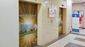 An elevator with a digital display indicating floor P.2 and a countdown timer. - The Royale Sentra Tower Kuning (Jakarta)