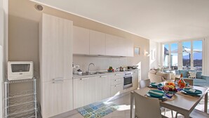 Family Apartment, 2 Bedrooms, Balcony, Lakeside (Sogno Sul Lago, Lakefront Balcony) | Private kitchen | Dining table - Sogno Sul Lago, Lakefront Balcony (Laveno Mombello)