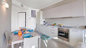 Family Apartment, 2 Bedrooms, Balcony, Lakeside (Sogno Sul Lago, Lakefront Balcony) | Private kitchen | Dining table - Sogno Sul Lago, Lakefront Balcony (Laveno Mombello)