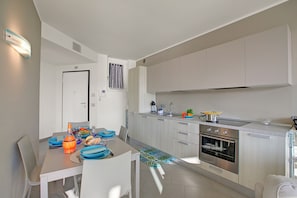 Family Apartment, Multiple Bedrooms, Lakeside (Sogno Sul Lago Lake Front) | Private kitchen | Fridge, microwave, oven, stovetop