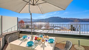 Family Apartment, 2 Bedrooms, Balcony, Lakeside (Sogno Sul Lago, Lakefront Balcony) | Outdoor dining - Sogno Sul Lago, Lakefront Balcony (Laveno Mombello)