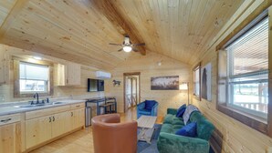 A wooden cabin interior with a kitchen, dining area, and living room. - 28 Mi to Downtown Louisville: Serene Farm Getaway (La Grange)