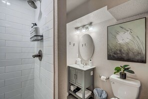 Shower, hair dryer, towels, shampoo