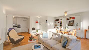 Family Apartment, Multiple Bedrooms, 2 Bathrooms (Ô Lac Ascona with Garden) | Living area | 21-inch flat-screen TV with cable channels